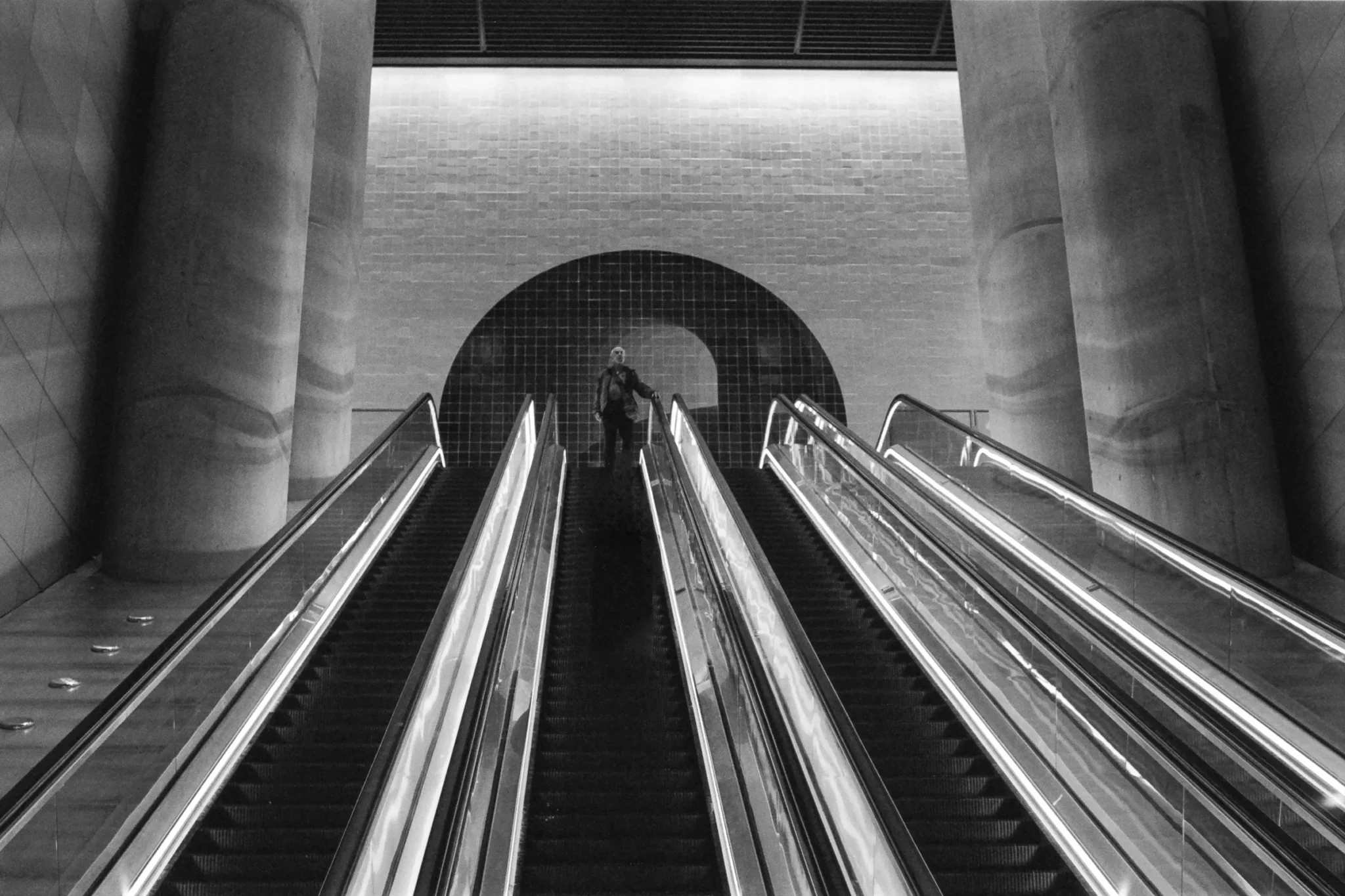 Black and white escalator photograph from the Grain and Geometry collection
